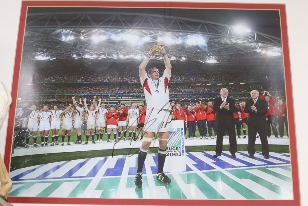 A signed photograph of Martin Johnson lifting the rugby world cup 2003, 38 x 49cm